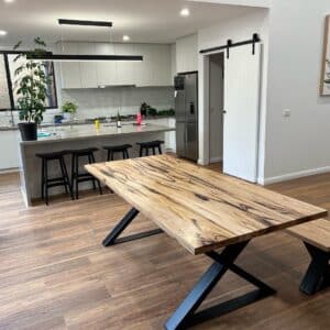 The Sorrento Recycled Messmate Timber Dining Table with black steel cross legs